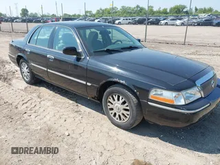 2005 Mercury Grand Marquis LS Premium z VIN 2MEFM75W55X640250, wystawiony jako IAAI lot #42442493 z przebiegiem 148 389 mil mil oraz . Historia ofert i sprzedaży dostępna na DreamBid. Obrazek 1.
