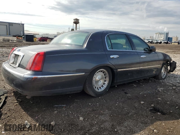1999 Lincoln Town Car Executive z VIN 1LNHM81W0XY644873, wystawiony jako Copart lot #52865095 z przebiegiem Nie podano mil oraz Szkoda całkowita • Salvage title. Historia ofert i sprzedaży dostępna na DreamBid. Obrazek 3.