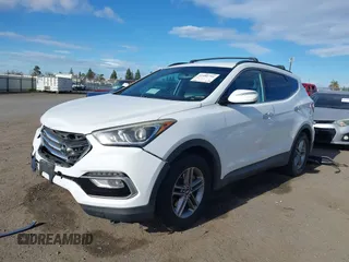 2017 Hyundai Santa Fe 2.4L z VIN 5XYZU3LB7HG438756, wystawiony jako IAAI lot #41480791 z przebiegiem 138 392 mil mil oraz . Historia ofert i sprzedaży dostępna na DreamBid. Obrazek 14.