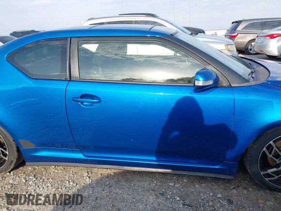 2014 Scion tC with VIN JTKJF5C72E3086001, listed as a IAAI auction lot 41721986 with 207,239 mi miles. Bid and sale history available at carsss.com. Image 13.