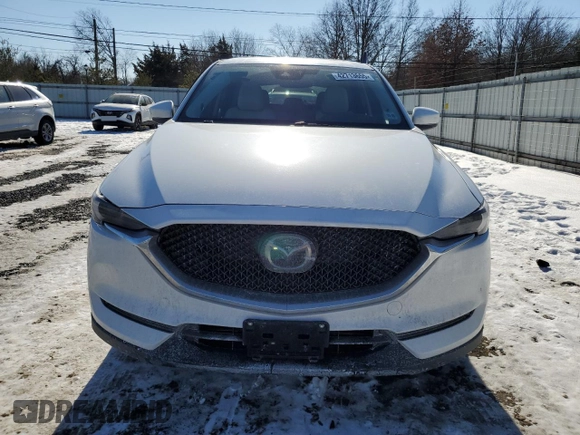 2021 Mazda CX-5 Grand Touring with VIN JM3KFBDM3M1305807, listed as a Copart auction lot 42713655 with 58,162 mi miles and Salvage Title. Bid and sale history available at DreamBid. Image 5.