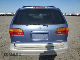 1998 Toyota Sienna LE with VIN 4T3ZF13CXWU011884, listed as a Copart auction lot 54601885 with 205,989 mi miles and Salvage Title. Bid and sale history available at carsss.com. Image 6.
