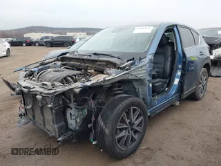 2017 Mazda CX-5 Grand Touring with VIN JM3KFADL9H0187338, listed as a IAAI auction lot 41382034 with 141,972 mi miles and . Bid and sale history available at carsss.com. Image 2.