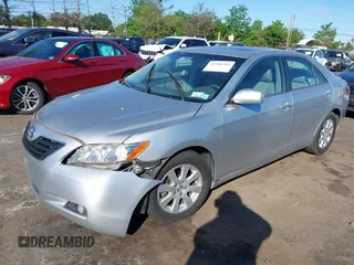 2007 Toyota Camry LE z VIN JTNBK46K473003622, wystawiony jako IAAI lot #42286264 z przebiegiem 105 630 mil mil oraz . Historia ofert i sprzedaży dostępna na DreamBid. Obrazek 2.