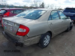 2003 Toyota Camry LE with VIN 4T1BE32KX3U123873, listed as a IAAI auction lot 42085492 with 166,901 mi miles and . Bid and sale history available at DreamBid. Image 4.