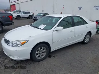 2002 Toyota Camry LE z VIN 4T1BE32K52U081479, wystawiony jako IAAI lot #41344104 z przebiegiem 243 950 mil mil oraz . Historia ofert i sprzedaży dostępna na DreamBid. Obrazek 17.