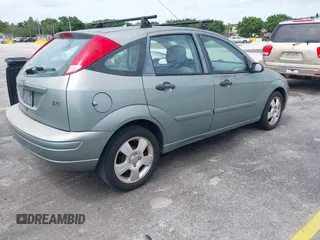2004 Ford Focus with VIN 3FAFP37Z74R103228, listed as a IAAI auction lot 42658143 with 90,519 mi miles and . Bid and sale history available at DreamBid. Image 4.