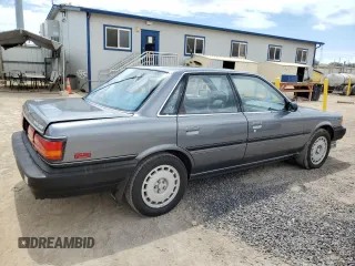 1990 Toyota Camry z VIN JT2VV21E2L0114723, wystawiony jako Copart lot #53584755 z przebiegiem 58 986 mil mil oraz Czysty tytuł • Clean title. Historia ofert i sprzedaży dostępna na DreamBid. Obrazek 3.