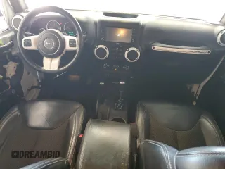 2015 Jeep Wrangler Unlimited Sahara with VIN 1C4BJWEG2FL620001, listed as a Copart auction lot 63914725 with 114,810 mi miles and Salvage title. Bid and sale history available at DreamBid. Image 8.