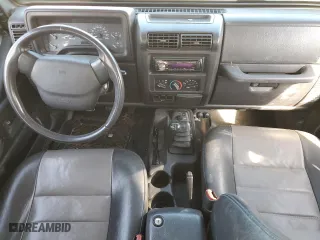 2000 Jeep Wrangler Sport with VIN 1J4FA49S4YP789348, listed as a Copart auction lot 50521365 with 0 mi miles and Salvage Title. Bid and sale history available at carsss.com. Image 8.