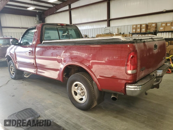 1999 Ford F-150 with VIN 1FTRF18W8XNB97257, listed as a Copart auction lot 87857815 with Not provided miles and Salvage title. Bid and sale history available at DreamBid. Image 2.