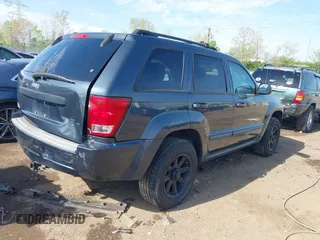 2007 Jeep Grand Cherokee Laredo with VIN 1J8GR48K77C582875, listed as a IAAI auction lot 42061653 with 259,767 mi miles. Bid and sale history available at carsss.com. Image 4.
