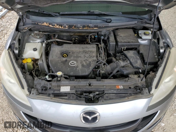 2012 Mazda 5 Touring z VIN JM1CW2CL6C0143536, wystawiony jako Copart lot #57579915 z przebiegiem 148 191 mil mil oraz Szkoda całkowita • Salvage title. Historia ofert i sprzedaży dostępna na DreamBid. Obrazek 12.