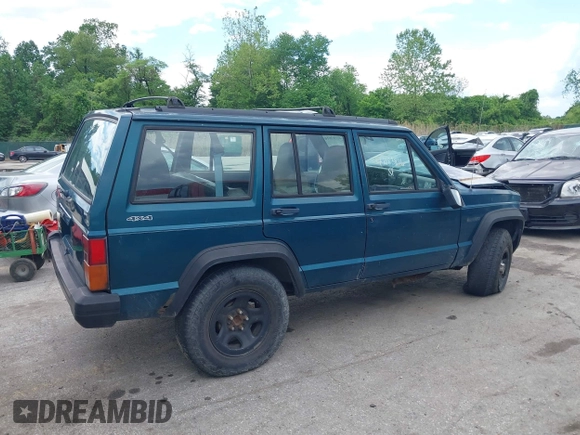 1996 Jeep Cherokee SE z VIN 1J4FJ28S8TL285634, wystawiony jako IAAI lot #42183816 z przebiegiem 260 237 mil mil oraz . Historia ofert i sprzedaży dostępna na DreamBid. Obrazek 13.