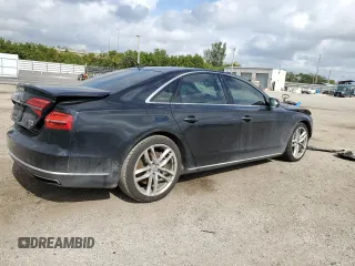 2015 Audi A8 4.0T with VIN WAUJ2AFD5FN013267, listed as a Copart auction lot 39065654 with 64,541 mi miles and . Bid and sale history available at DreamBid. Image 3.
