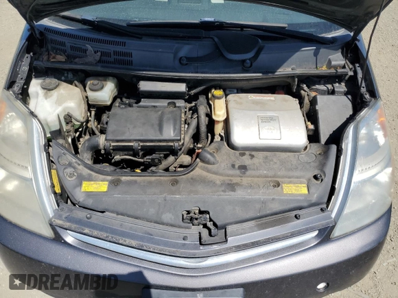 2007 Toyota Prius z VIN JTDKB20U473211597, wystawiony jako Copart lot #58437915 z przebiegiem 252 737 mil mil oraz Szkoda całkowita • Salvage title. Historia ofert i sprzedaży dostępna na DreamBid. Obrazek 11.
