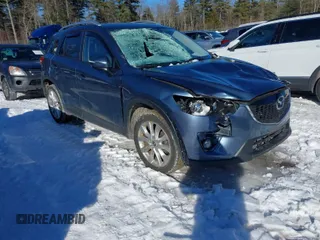 2015 Mazda CX-5 Grand Touring with VIN JM3KE4DY1F0541592, listed as a IAAI auction lot 41585018 with 113,016 mi miles. Bid and sale history available at carsss.com. Image 1.