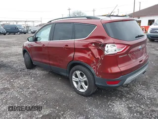 2016 Ford Escape SE with VIN 1FMCU9GX8GUB28820, listed as a IAAI auction lot 40874359 with 134,459 mi miles. Bid and sale history available at carsss.com. Image 3.
