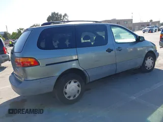 1999 Toyota Sienna LE z VIN 4T3ZF13C0XU117228, wystawiony jako IAAI lot #42384745 z przebiegiem 292 487 mil mil oraz . Historia ofert i sprzedaży dostępna na DreamBid. Obrazek 4.