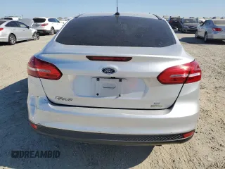2018 Ford Focus SE with VIN 1FADP3FE4JL308909, listed as a Copart auction lot 61489005 with 58,613 mi miles and Salvage title. Bid and sale history available at DreamBid. Image 6.