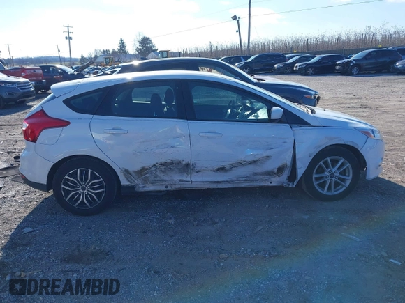 2012 Ford Focus SE z VIN 1FAHP3K29CL265135, wystawiony jako IAAI lot #40989480 z przebiegiem 158 742 mil mil oraz . Historia ofert i sprzedaży dostępna na DreamBid. Obrazek 13.