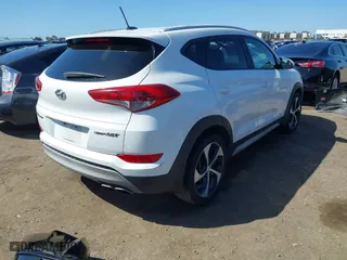 2017 Hyundai Tucson Value with VIN KM8J33A27HU438902, listed as a IAAI auction lot 41835502 with 84,885 mi miles. Bid and sale history available at carsss.com. Image 4.