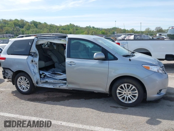 2014 Toyota Sienna XLE with VIN 5TDYK3DC0ES451307, listed as a IAAI auction lot 42093569 with 105,721 mi miles and . Bid and sale history available at DreamBid. Image 14.