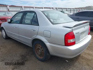 2002 Mazda Protege LX z VIN JM1BJ226X20523807, wystawiony jako IAAI lot #42373241 z przebiegiem 218 634 mil mil oraz . Historia ofert i sprzedaży dostępna na DreamBid. Obrazek 3.