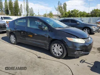 2010 Honda Insight LX with VIN JHMZE2H50AS009869, listed as a Copart auction lot 53031515 with 194,860 mi miles and Salvage Title. Bid and sale history available at DreamBid. Image 4.