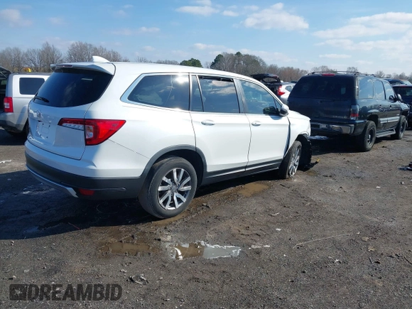 2021 Honda Pilot EX-L with VIN 5FNYF5H57MB037861, listed as a IAAI auction lot 41566924 with 42,867 mi miles. Bid and sale history available at carsss.com. Image 4.