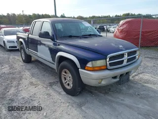 2003 Dodge Dakota SLT with VIN 1D7HL48NX3S141755, listed as a IAAI auction lot 41887914 with 171,302 mi miles and . Bid and sale history available at carsss.com. Image 1.