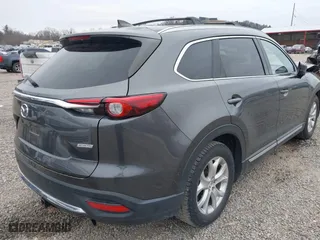 2016 Mazda CX-9 Grand Touring with VIN JM3TCBDY1G0103560, listed as a IAAI auction lot 41344813 with 123,588 mi miles. Bid and sale history available at carsss.com. Image 4.