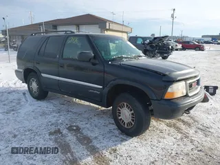 1999 GMC Jimmy SLE with VIN 1GKDT13W5X2520020, listed as a IAAI auction lot 41337936 with 277,615 mi miles. Bid and sale history available at carsss.com. Image 1.