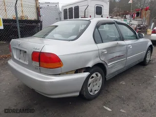 1997 Honda Civic EX with VIN 2HGEJ8643VH561244, listed as a IAAI auction lot 41810988 with 130,000 mi miles. Bid and sale history available at carsss.com. Image 4.