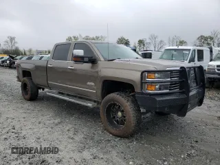 2015 Chevrolet Silverado 3500HD High Country z VIN 1GC4K1E84FF551263, wystawiony jako Copart lot #51272545 z przebiegiem 249 026 mil mil oraz Tytuł czysty. Historia ofert i sprzedaży dostępna na DreamBid. Obrazek 4.