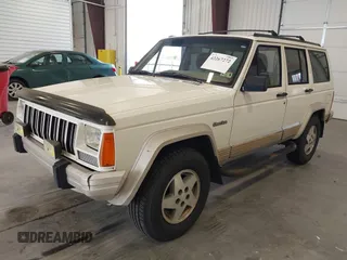 1996 Jeep Cherokee Country with VIN 1J4FT78S5TL232090, listed as a IAAI auction lot 42267272 with 255,417 mi miles and . Bid and sale history available at DreamBid. Image 2.