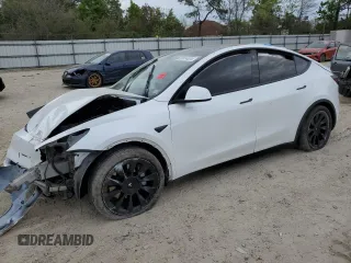 2021 Tesla Model Y Standard Range z VIN 5YJYGDED1MF109091, wystawiony jako Copart lot #50414004 z przebiegiem Nie podano mil oraz Szkody całkowita. Historia ofert i sprzedaży dostępna na DreamBid. Obrazek 1.