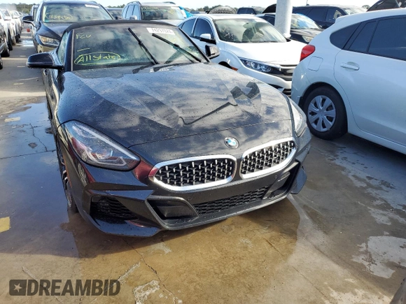 2020 BMW Z4 sDrive30i with VIN WBAHF3C06LWW75400, listed as a Copart auction lot 74297024 with 34,559 mi miles and Salvage Title. Bid and sale history available at carsss.com. Image 5.