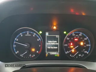 2018 Toyota RAV4 XLE with VIN JTMWFREV2JJ740145, listed as a Copart auction lot 52214075 with 129,940 mi miles and Salvage title. Bid and sale history available at DreamBid. Image 9.
