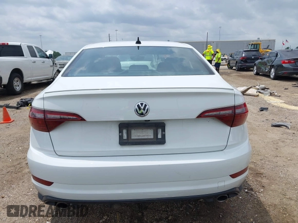 2021 Volkswagen Jetta S z VIN 3VW6T7BU2MM061165, wystawiony jako IAAI lot #42423828 z przebiegiem 41 603 mil mil oraz . Historia ofert i sprzedaży dostępna na DreamBid. Obrazek 16.