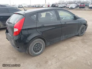 2014 Hyundai Accent GS with VIN KMHCT5AE6EU197814, listed as a IAAI auction lot 41697539 with 228,490 mi miles. Bid and sale history available at carsss.com. Image 4.