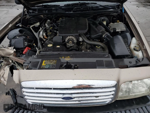 2005 Ford Crown Victoria LX z VIN 2FAFP74W05X122403, wystawiony jako Copart lot #45305825 z przebiegiem 202 381 mil mil oraz Szkoda całkowita • Salvage title. Historia ofert i sprzedaży dostępna na DreamBid. Obrazek 11.