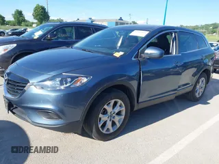 2015 Mazda CX-9 Sport z VIN JM3TB2BAXF0465720, wystawiony jako IAAI lot #42305436 z przebiegiem 130 543 mil mil oraz . Historia ofert i sprzedaży dostępna na DreamBid. Obrazek 2.