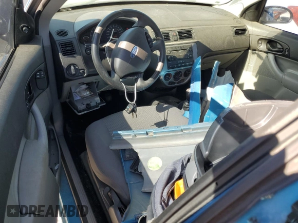 2007 Ford Focus S z VIN 1FAFP31N77W244856, wystawiony jako Copart lot #88972705 z przebiegiem Nie podano mil oraz Szkoda całkowita • Salvage title. Historia ofert i sprzedaży dostępna na DreamBid. Obrazek 8.