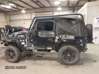 1999 Jeep Wrangler Sahara z VIN 1J4FY49S4XP432567, wystawiony jako IAAI lot #41562455 z przebiegiem Nie podano mil oraz . Historia ofert i sprzedaży dostępna na DreamBid. Obrazek 14.