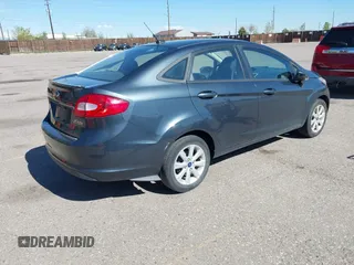2011 Ford Fiesta SE with VIN 3FADP4BJ7BM135864, listed as a IAAI auction lot 42134479 with 118,573 mi miles. Bid and sale history available at carsss.com. Image 4.