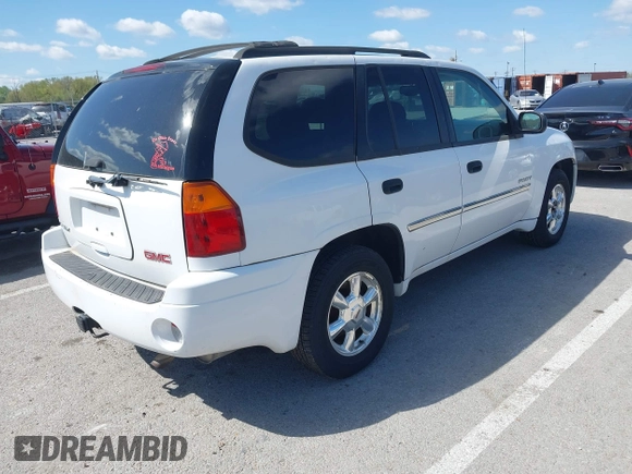 2006 GMC Envoy SLE with VIN 1GKDT13SX62258586, listed as a IAAI auction lot 42045967 with 143,225 mi miles. Bid and sale history available at carsss.com. Image 4.