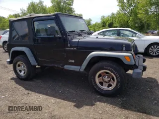 2002 Jeep Wrangler X z VIN 1J4FA39S12P759967, wystawiony jako Copart lot #57851495 z przebiegiem 178 035 mil mil oraz Szkoda całkowita • Salvage title. Historia ofert i sprzedaży dostępna na DreamBid. Obrazek 4.