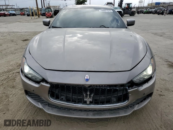 2016 Maserati Ghibli S Q4 z VIN ZAM57RTA6G1172334, wystawiony jako Copart lot #56601575 z przebiegiem 109 524 mil mil oraz Szkody całkowita. Historia ofert i sprzedaży dostępna na DreamBid. Obrazek 5.
