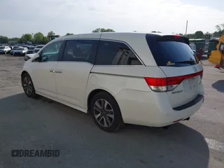 2014 Honda Odyssey Touring with VIN 5FNRL5H94EB001479, listed as a IAAI auction lot 41123678 with 147,269 mi miles and . Bid and sale history available at carsss.com. Image 3.